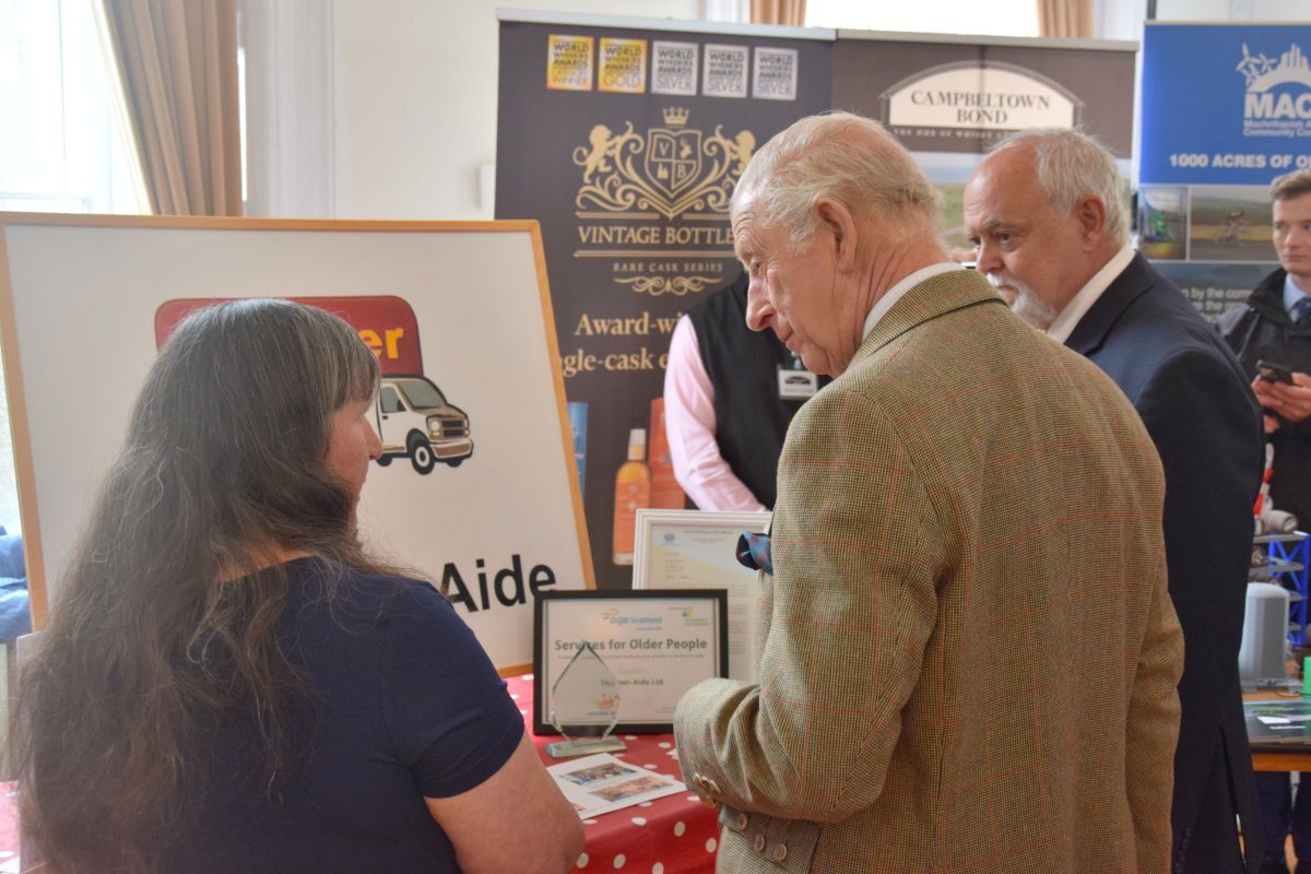 Susan Paterson of Shopper-Aide chatting with The King.