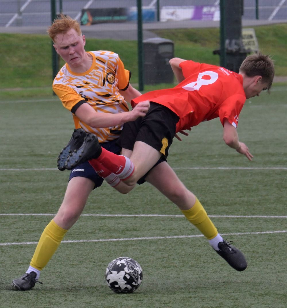 A Nairn player in an aerial tackle with Fort's Sebi Mrazek. Photograph: Iain Ferguson, alba.photos.