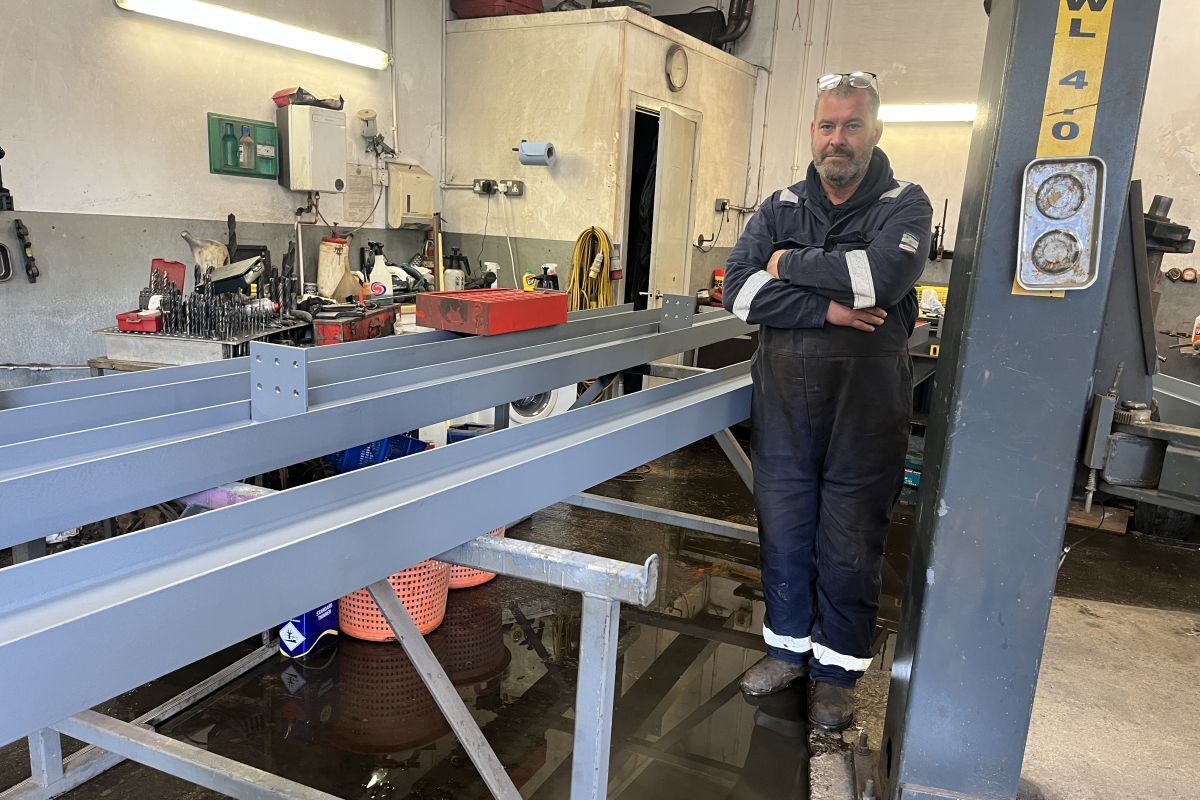 Paul Birney in his flooded workshop on the Lochavullin Industrial Estate when water stopped work over safety concerns.