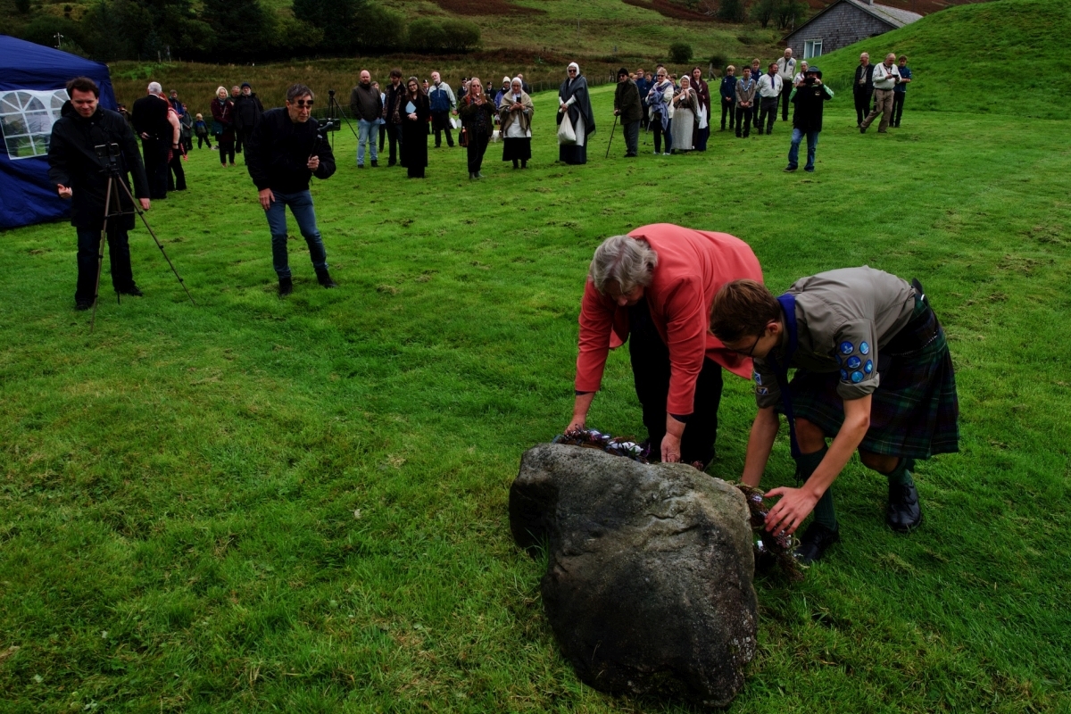Jan Brown, convenor of Auchindrain, laid a wreath on behalf of the diaspora while scout David Duncan placed another on behalf of today&rsquo;s youth and future generations. Photograph: Stewart Cunningham