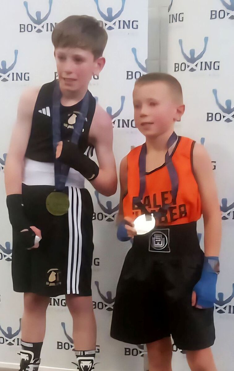 Young Charlie Varley (right) on the podium with his silver medal. Photograph supplied.