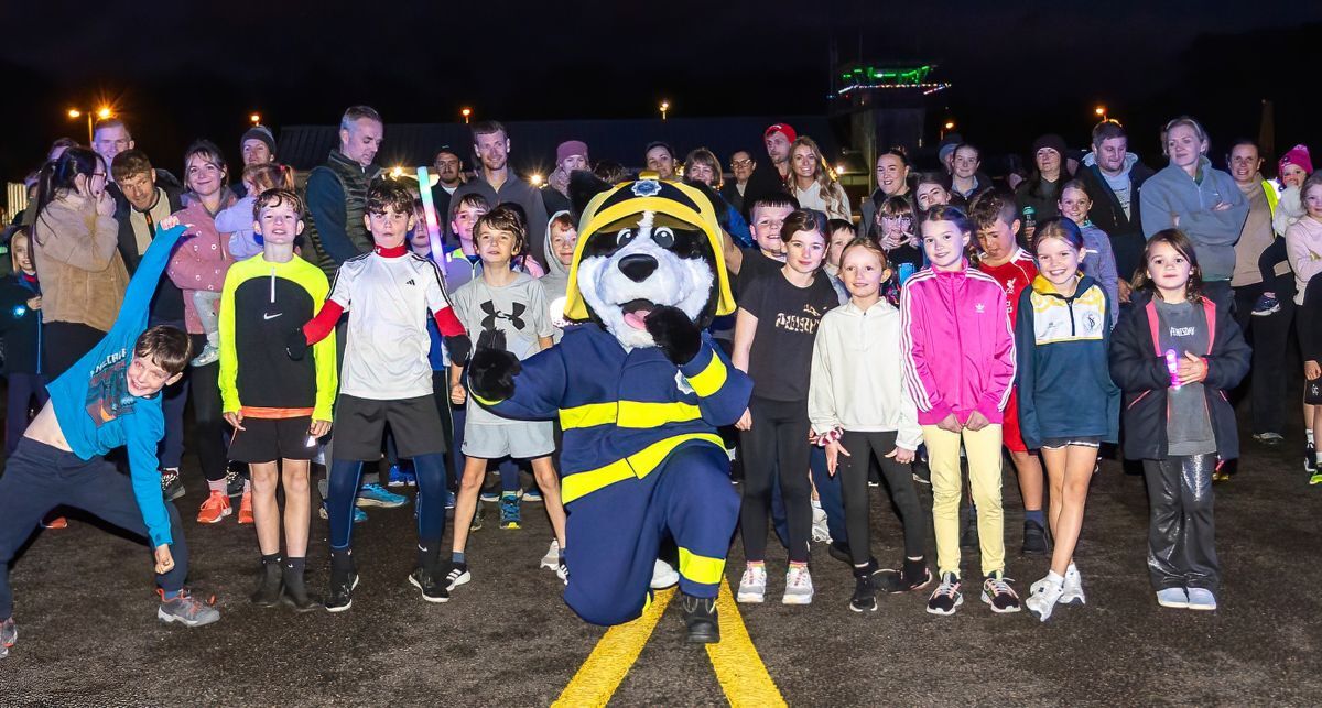 Children pose with a mascot before the children's race. Photo: Stephen Lawson Children pose with a mascot before the children's race. Photo: Stephen Lawson