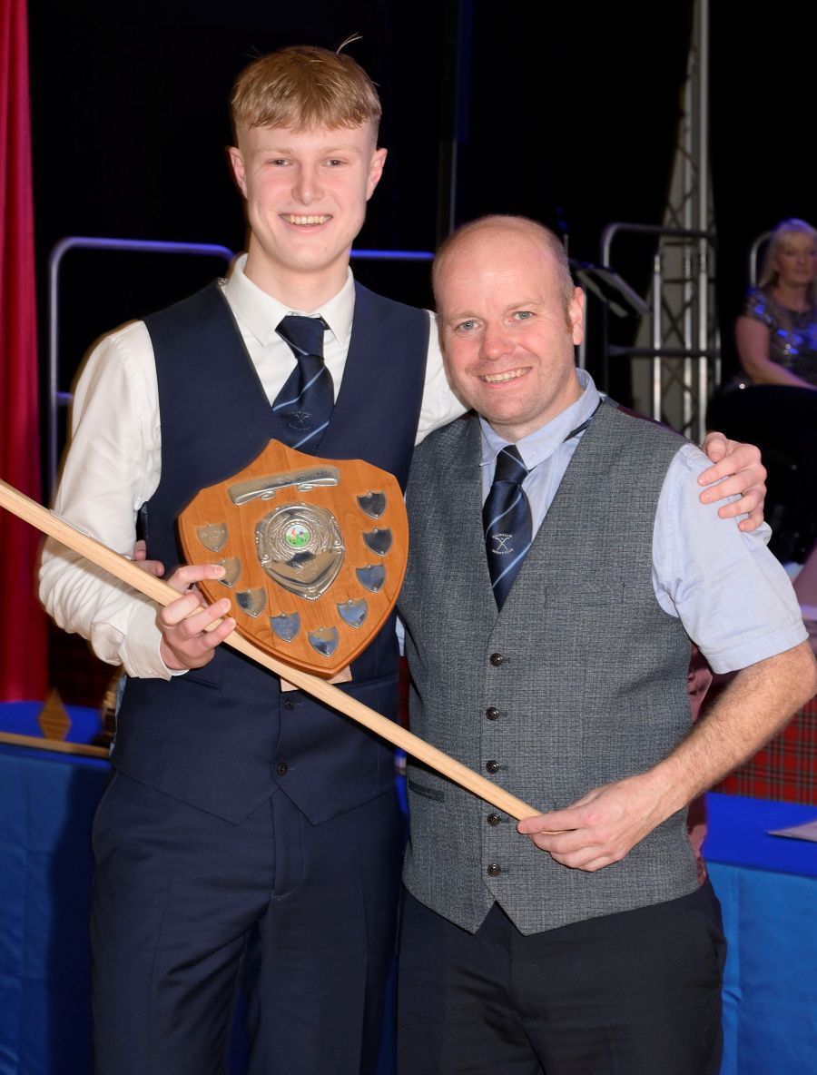 Alexander MacNiven, 1st Team Player of the Year is presented with his award by team Manager Archie MacPherson. Photograph: Iain Ferguson, alba.photos. Alexander MacNiven, 1st Team Player of the Year is presented with his award by team Manager Archie MacPherson. Photograph: Iain Ferguson, alba.photos.