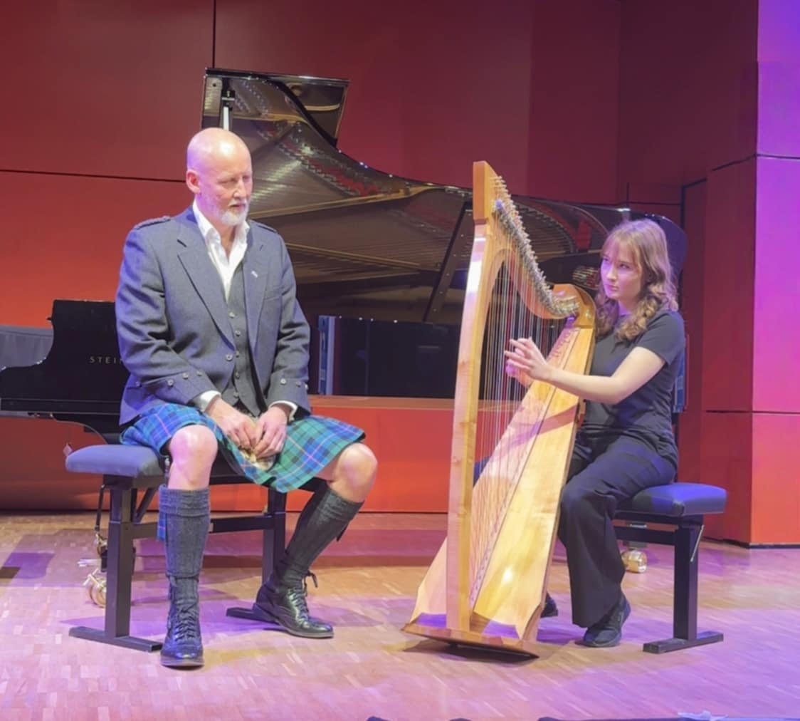 Aisling accompanies Richard on the clarsach. Photograph: Frances Coyle. Aisling accompanies Richard on the clarsach. Photograph: Frances Coyle.