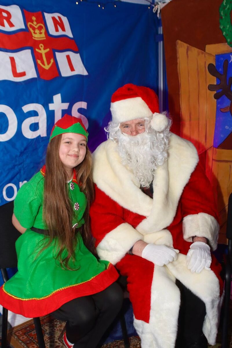 Santa with his elf Bella.