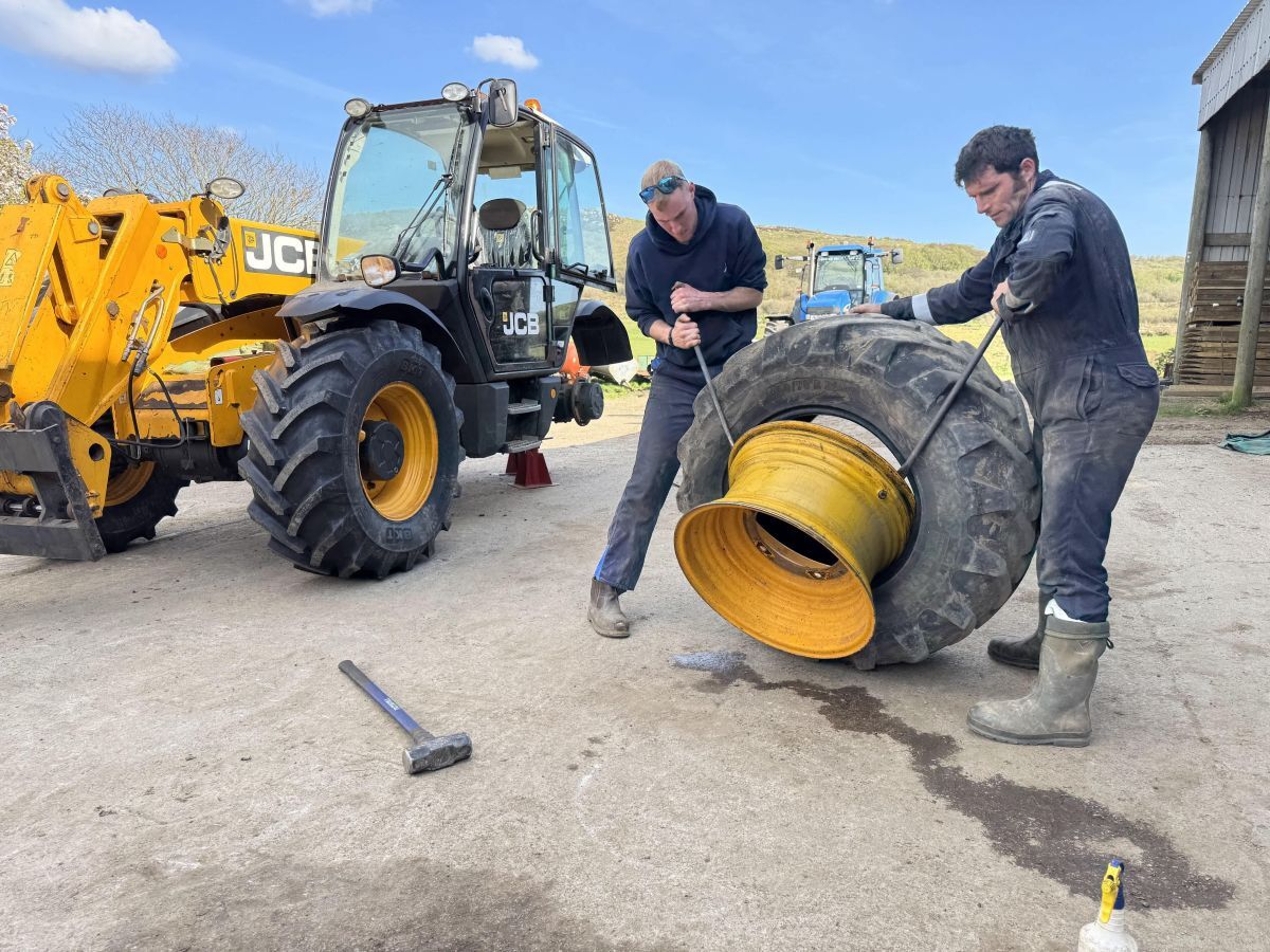 Sean Harvey of Tarbert Farm giving Guy a hand with some essential machinery maintenance. Photograph: UKTV/North One. Sean Harvey of Tarbert Farm giving Guy a hand with some essential machinery maintenance. Photograph: UKTV/North One.