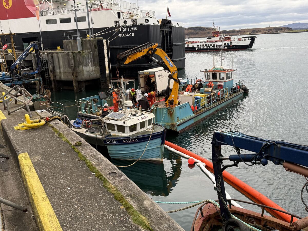 Sunken boat lifted at Oban's Railway Pier