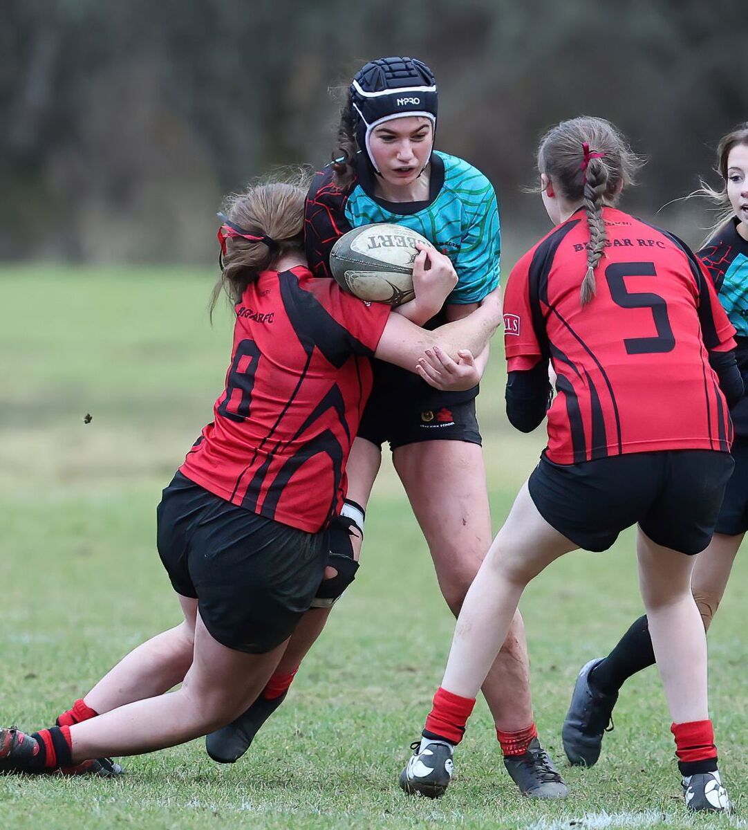 SL T06 Oban U17s v Biggar U17s 05 Georgia Hyde being tackled by two Biggar players Photograph Stephen Lawson web SL T06 Oban U17s v Biggar U17s 05 Georgia Hyde being tackled by two Biggar players Photograph Stephen Lawson web