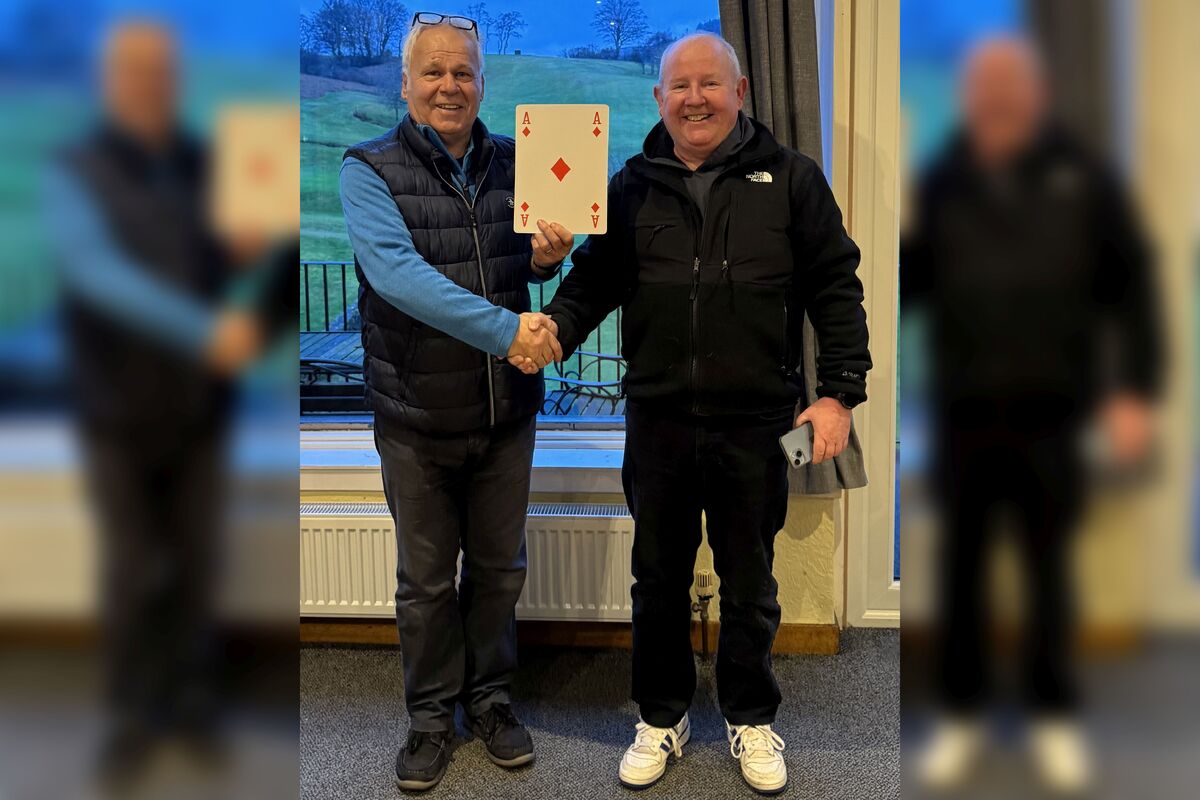 Robert Allison, winner of the inaugural Lamlash Golf Club Chase the Ace draw. Robert won the jackpot of &pound;2,909 and is pictured with past captain Alastair Crawford. Photograph: Fiona Carswell.