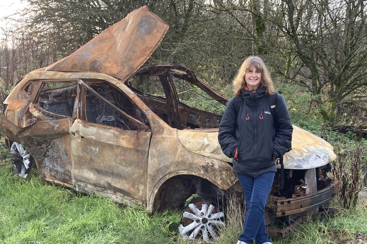 Professor Lynne Pearce with a car that has not stood the test of time - unlike some roads that have moved on overt time with the travel flow. Photograph: Lynne Pearce