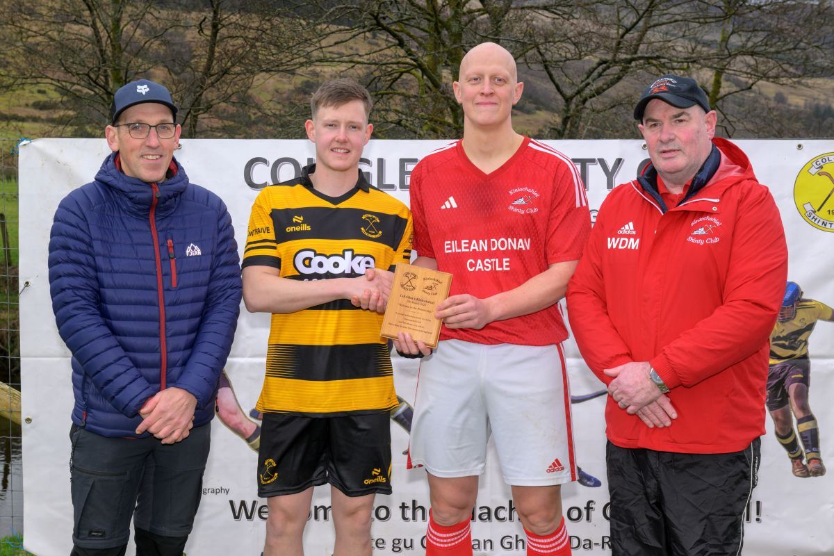 Col Glen were presented with a plaque by Kinlochshiel Shinty Club, before the match. Photograph: Neil G Paterson.
