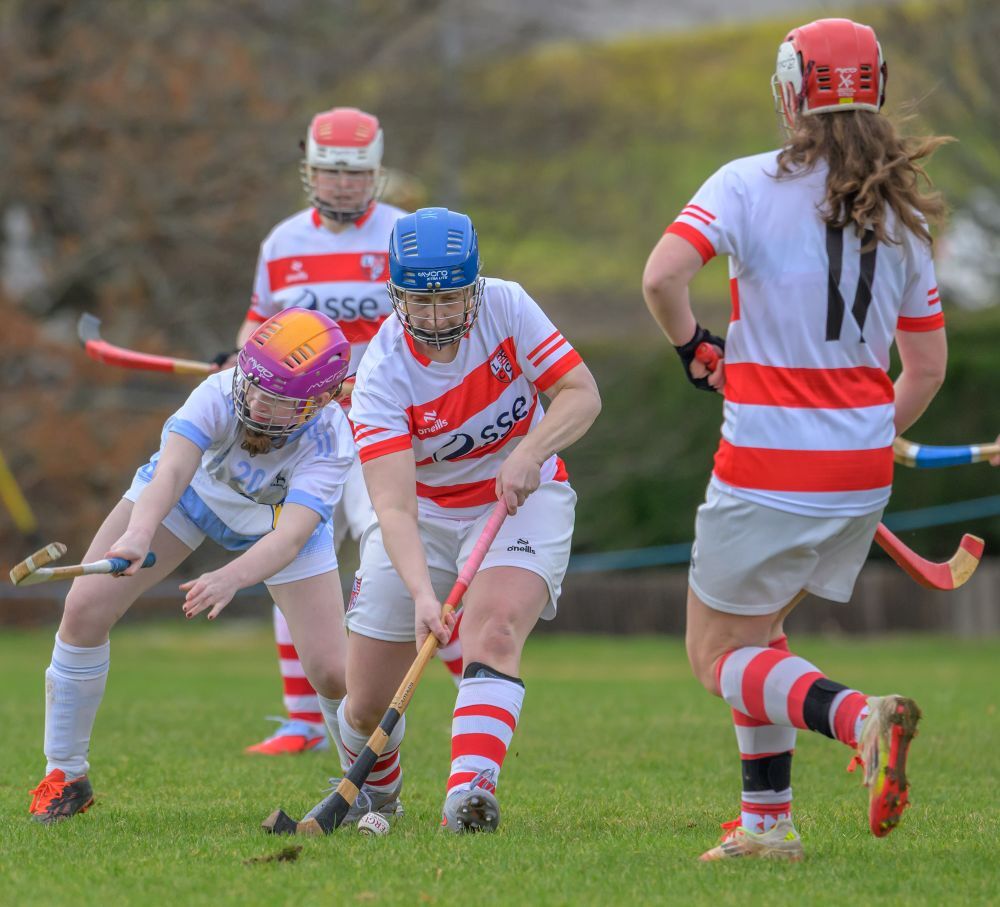 Player of the match Elaine Wink clears the ball upfield. Photograph: Phil Hughes.