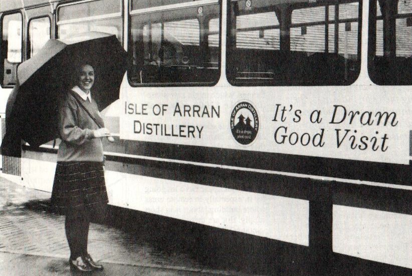Gillian McCreadie admires a Stagecoach bus, all of which were now advertising Lochranza Distillery.