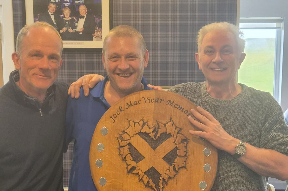 Jock MacVicar Memorial Doyen Open winners Neil Brodie, centre, and Iain McGlynn, right, receiving the shield from club captain Douglas Neilson.