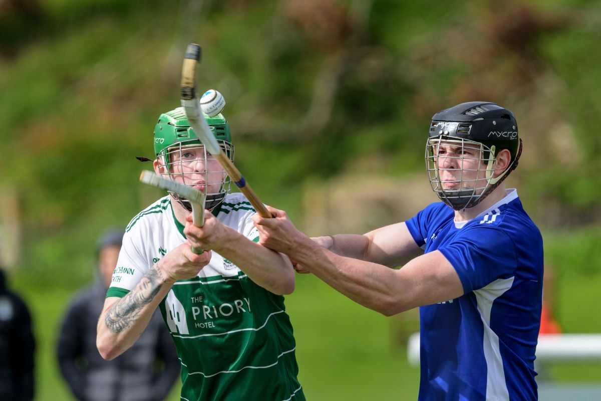 Beauly's Finlay MacLennan (left) and Kilmallie's Seumas Macfarlane clash. Photograph: Neil G Paterson.