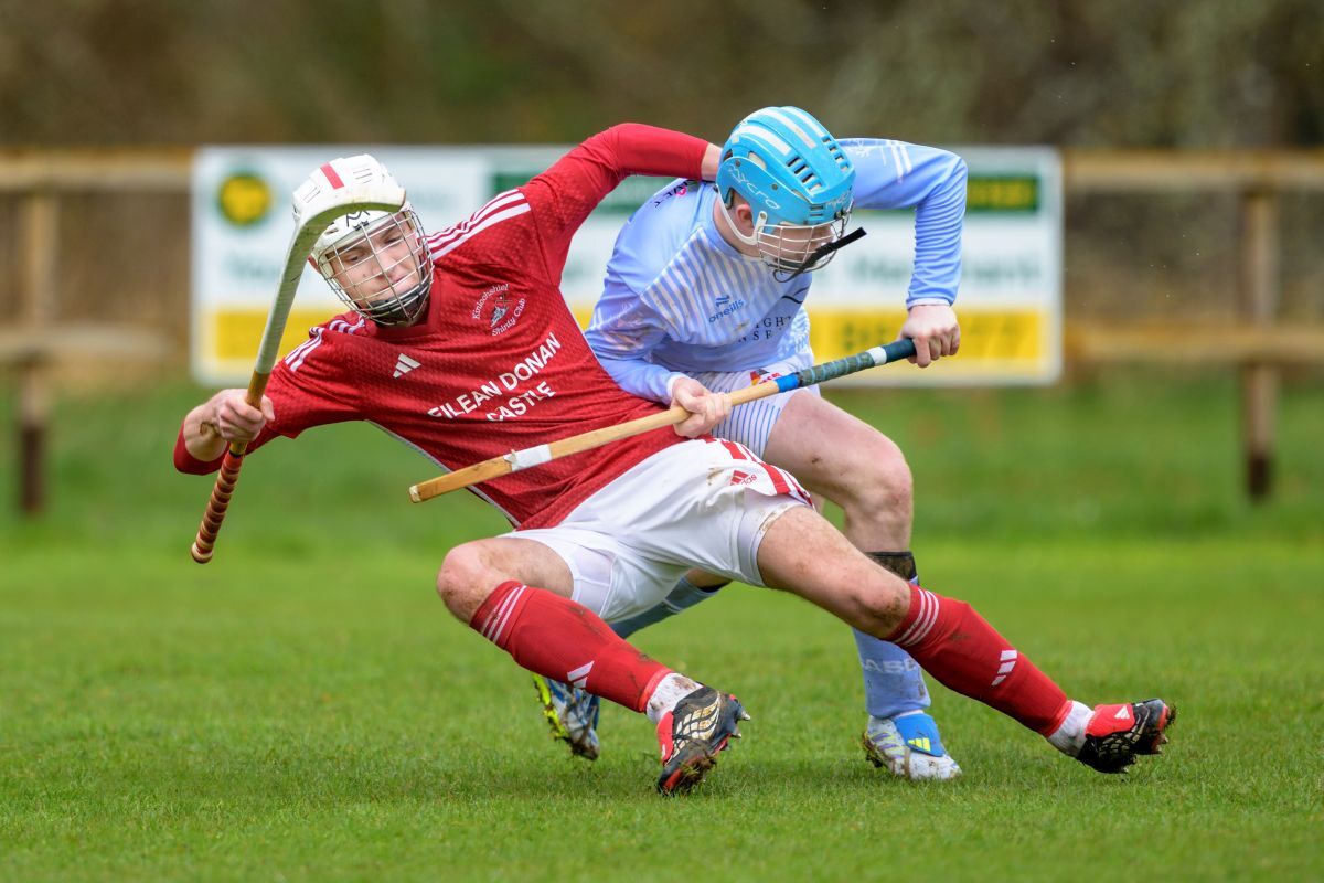 Kinlochshiel's Arron Jack (left) fends off Ali Taylor. Photograph: Neil G Paterson.