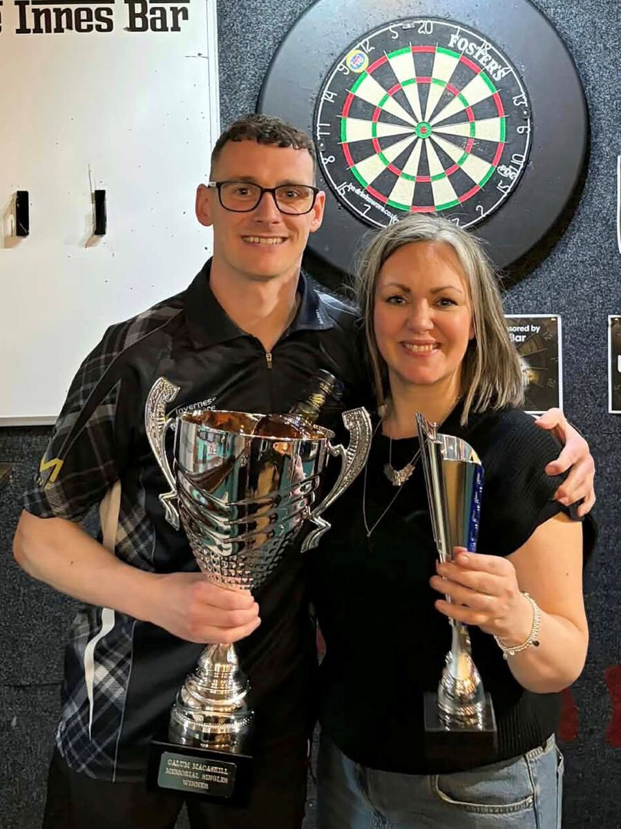 Fort William's Martyn Cameron is presenetd with his trophy by Nicola Gray, daughter of the late Calum MacAskill. Photograph supplied by Martyn Cameron.