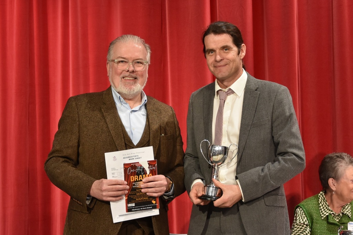 Andy McNamara collected a trophy for the best moment of theatre from adjudicator, Kevin Boland at the Arran Drama Festival.