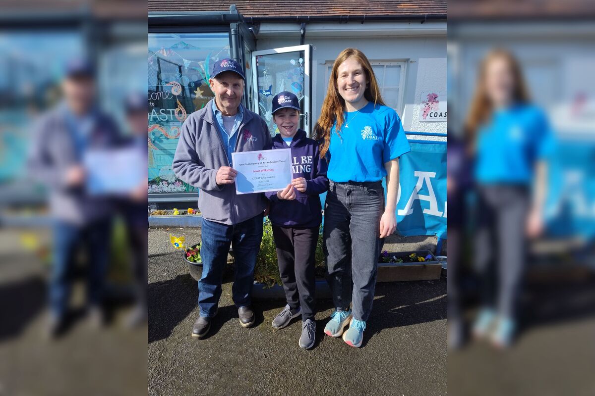 COAST co-founder Howard Wood and communications manager, Lily Holbrook, with COAST ambassador Lewis Wilkinson. Photograph: Supplied. 