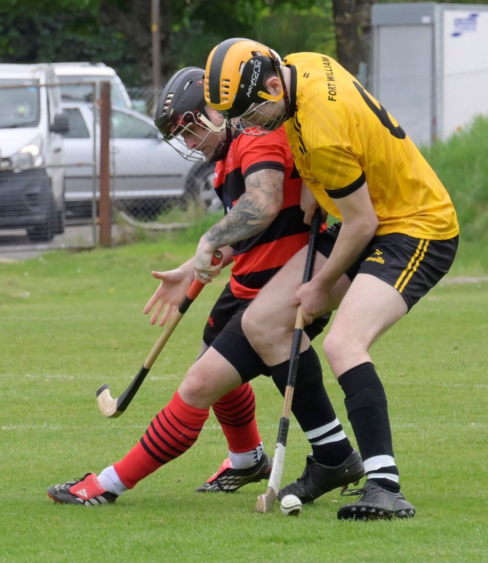 Fort's Craig MacDonald tackles Connor Howe as he nears the home team's goal. Photograph: Iain Ferguson, alba.photos.