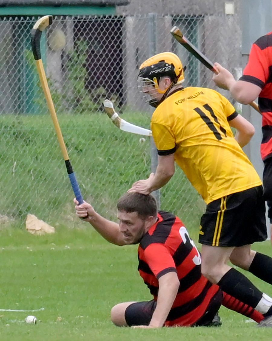 Fort's Greig Kelly prepares to leap a fallen Oban player. Photograph: Iain Ferguson, alba.photos.