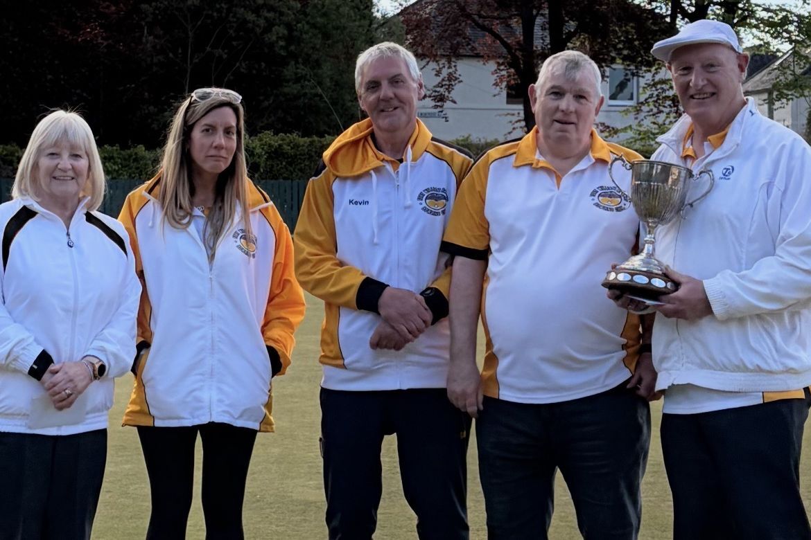 Winners line up from the Stewart Cup bowling competition at Fort William Railway Club over the weekend wih Kevin Douglas, in the centre, presenting the prizes. Photograph: Sharon Wells