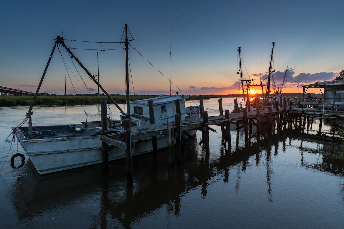 sun setting on the shrimp boat docks along the Darien River at the port town of Darien AdobeStock 363630614 sun setting on the shrimp boat docks along the Darien River at the port town of Darien AdobeStock 363630614