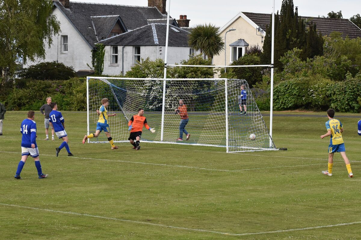 Jamie Worthington blasts the ball into the goal as Brodick keeper Christopher MacNeil looks on. Jamie Worthington blasts the ball into the goal as Brodick keeper Christopher MacNeil looks on.
