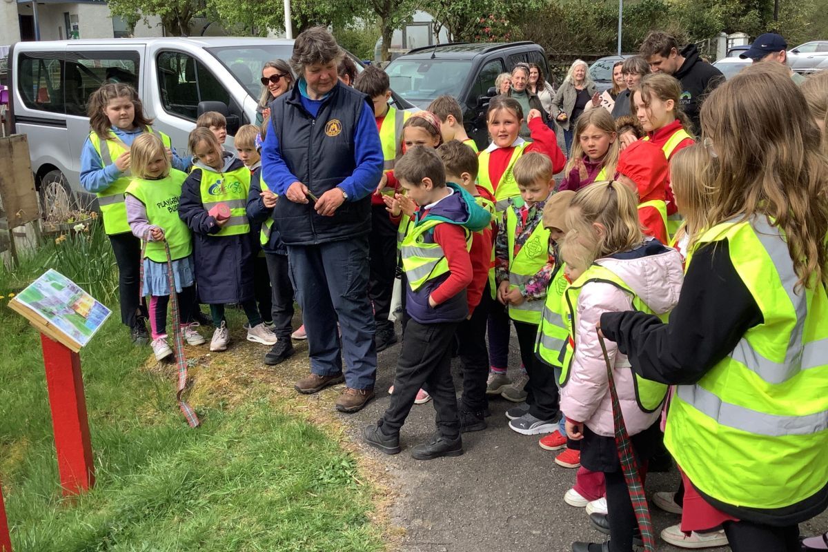 Lochdonhead Primary School pupils at the re-opening of their nature trail with Mull ranger Jan Dunlop cutting the ribbon. Photograph: Lochdonhead Primary School