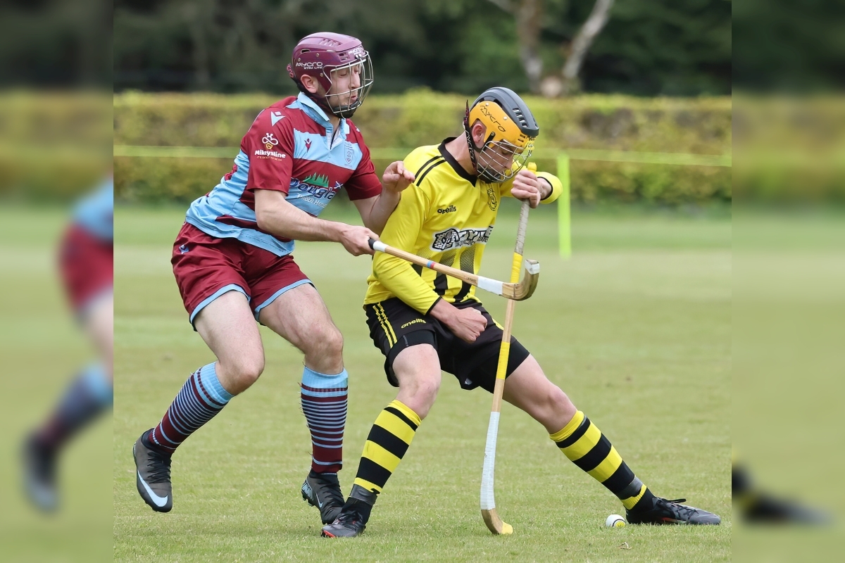  Coll MacKay of Inveraray blocks Strathglass's Penri Jones from reaching the ball. Photograph: Stephen Lawson