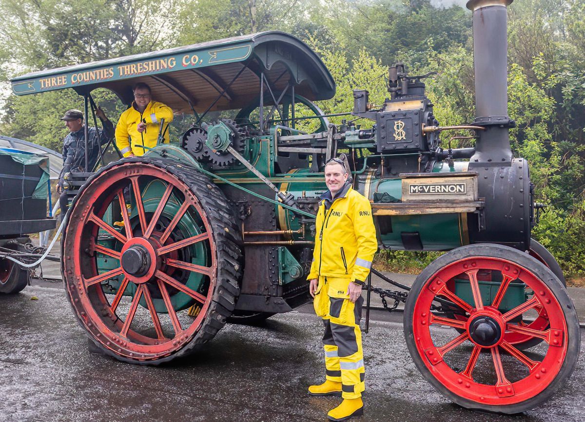 Oban lifeboat's Ali Cerexhe and Tom Kennedy get ready to wave off engine driver Dave Nixon and Vern the traction engine. Photograph: Stephen Lawson/RNLI