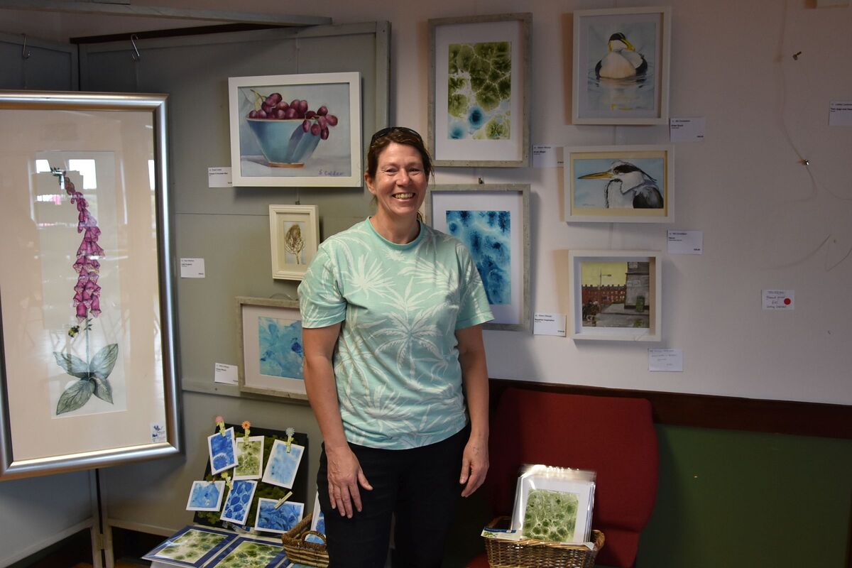 New exhibitor, Ali Allsopp with some of her prints behind her.