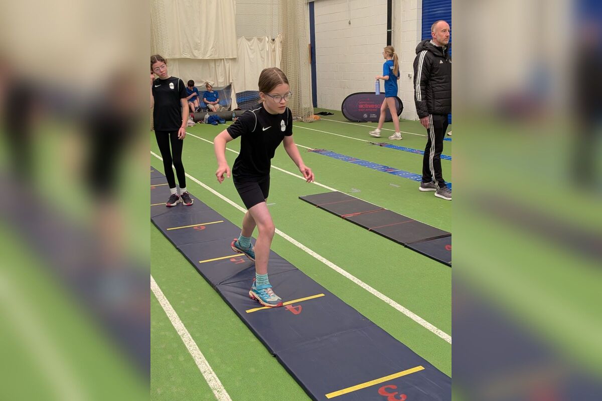 An Arran athlete competes in the triple jump. Photograph: Ross Dobson. An Arran athlete competes in the triple jump. Photograph: Ross Dobson.
