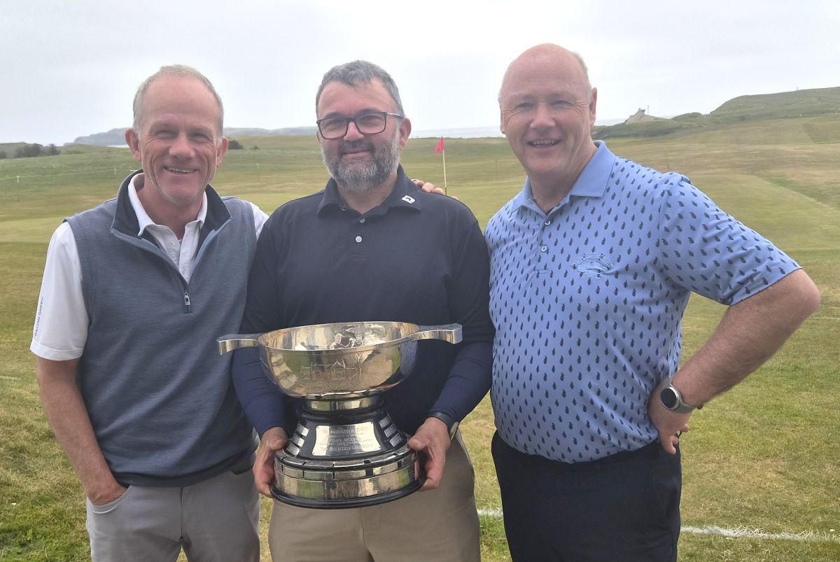 Amod/MacNeill pairs winners David MacBrayne, right, and Fraser McNair, centre, with club captain Douglas Neilson.