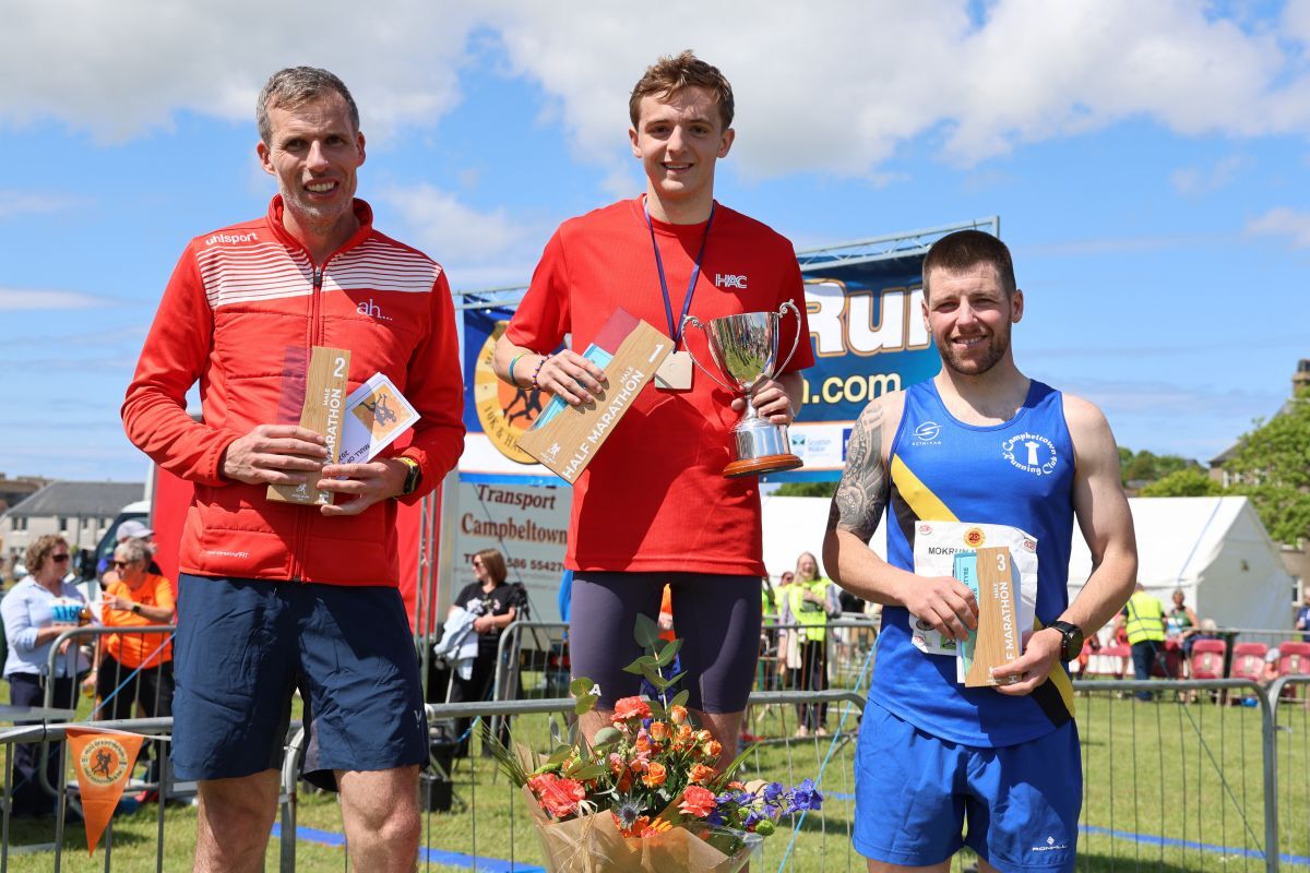 Connell Metcalf, centre, claimed victory in the men’s half marathon ahead of second-placed Andrew Anderson, left, and third-placed Keith Mitchell, right. Photograph: Kenny Craig.