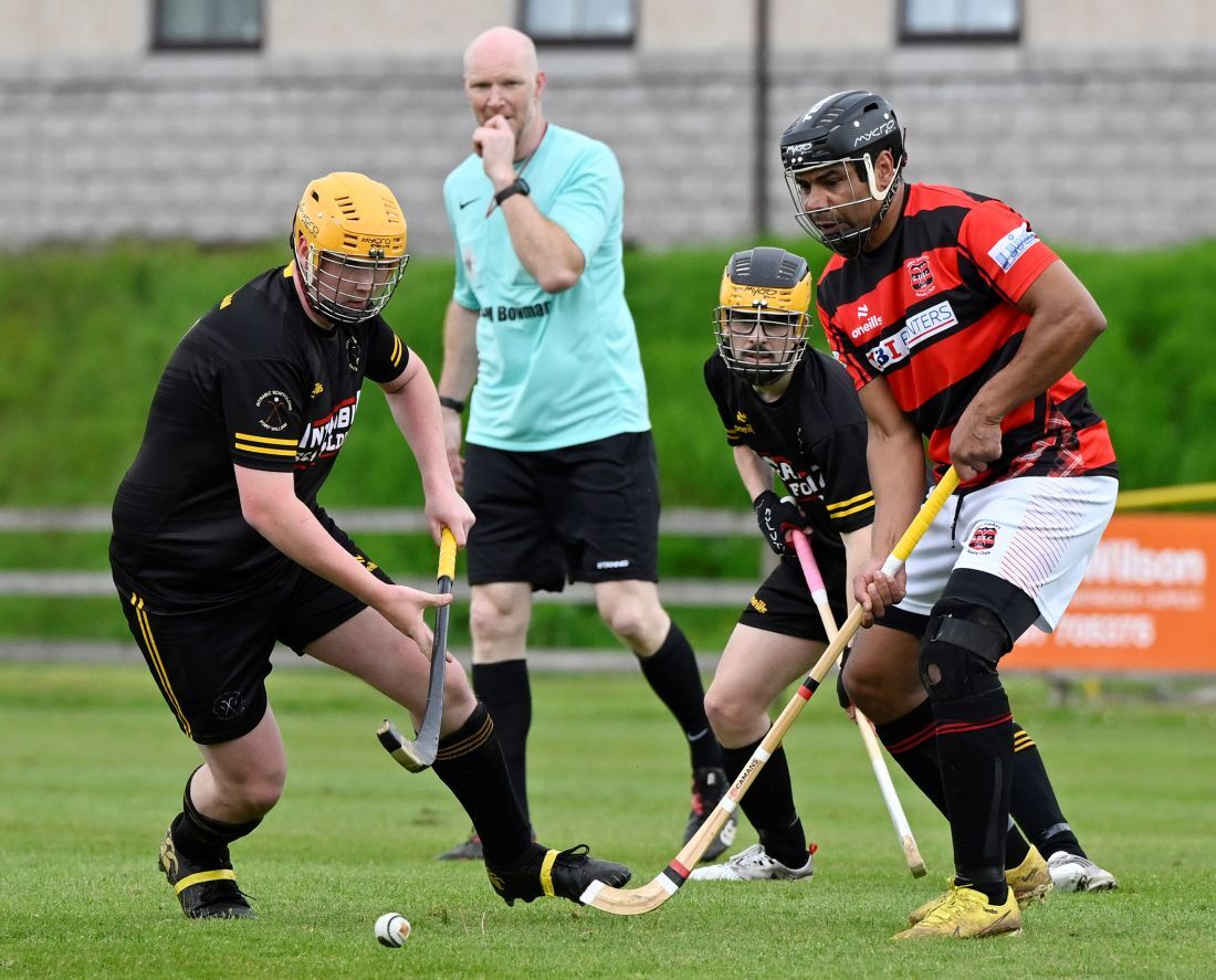 WEB NO F22 Shinty 26 Fort v Glenurquhart Arron MacPhee and Murdo Shaw FW Eddie Tembo G ref John Angus Gillies IF