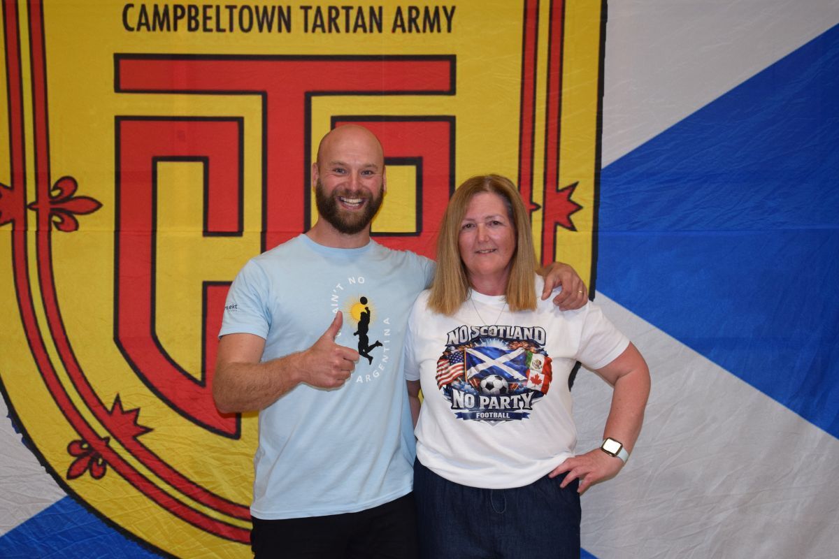 Singer-songwriter Nick Morgan with Dalintober teacher Elspeth Campbell, whose application secured the school a place on the nationwide tour.