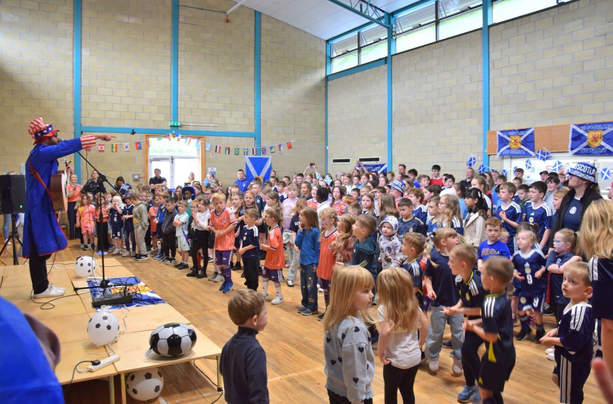 Pupils and staff sang, danced and waved flags as World Cup fever came to Dalintober Primary School.