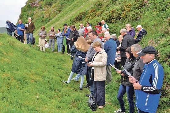 2016: The attendees of the St Columba Conventicle at Southend sang hymns while beating away the midges. 2016: The attendees of the St Columba Conventicle at Southend sang hymns while beating away the midges.