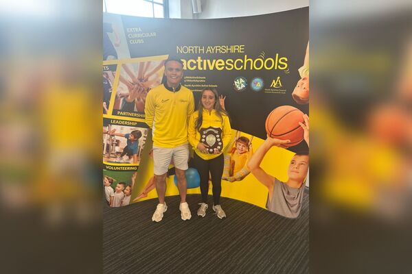 Active Schools co-ordinator, Ross Dobson, with Mia Palmer who received the Outstanding Commitment Award. Photograph: NASA.
