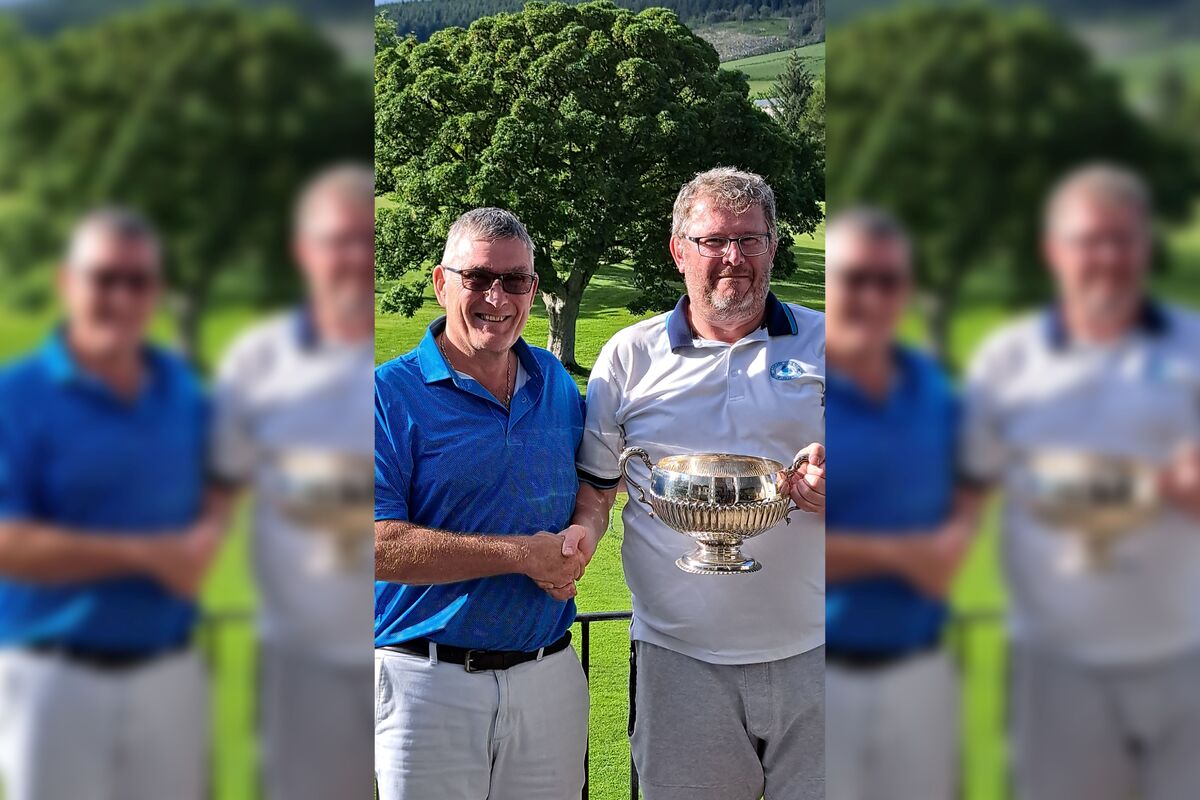 Lee Dutton, right, being presented with the Fleet Cup trophy from Lamlash Golf Club captain, David Drennan. Photograph: LGC. Lee Dutton, right, being presented with the Fleet Cup trophy from Lamlash Golf Club captain, David Drennan. Photograph: LGC.