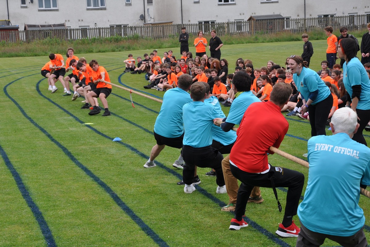 Eight senior boys give it their best shot, but it’s not enough to overpower their tug-of-war opponents, the men’s staff team. 