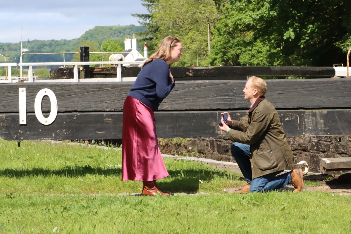 James Minshall goes down on one knee to propose to Virginia Etchells two years to the day after the met at lock 10 on the Crinan canal. Photograph: Danielle Freaney