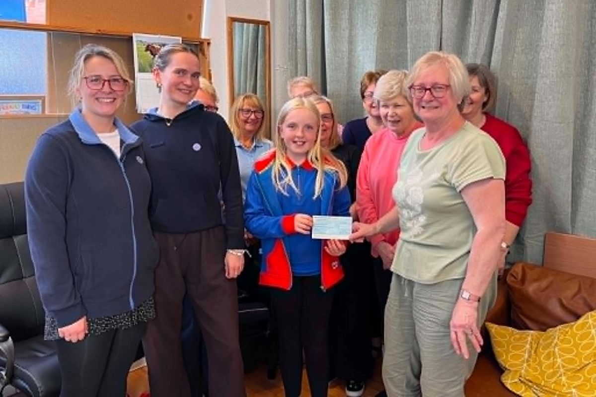 Nimble Fingers crafters present a cheque for £550 to Rhona O'May, Hayley Lowdon and Emma Ramsay of Campbeltown Guides Unit.