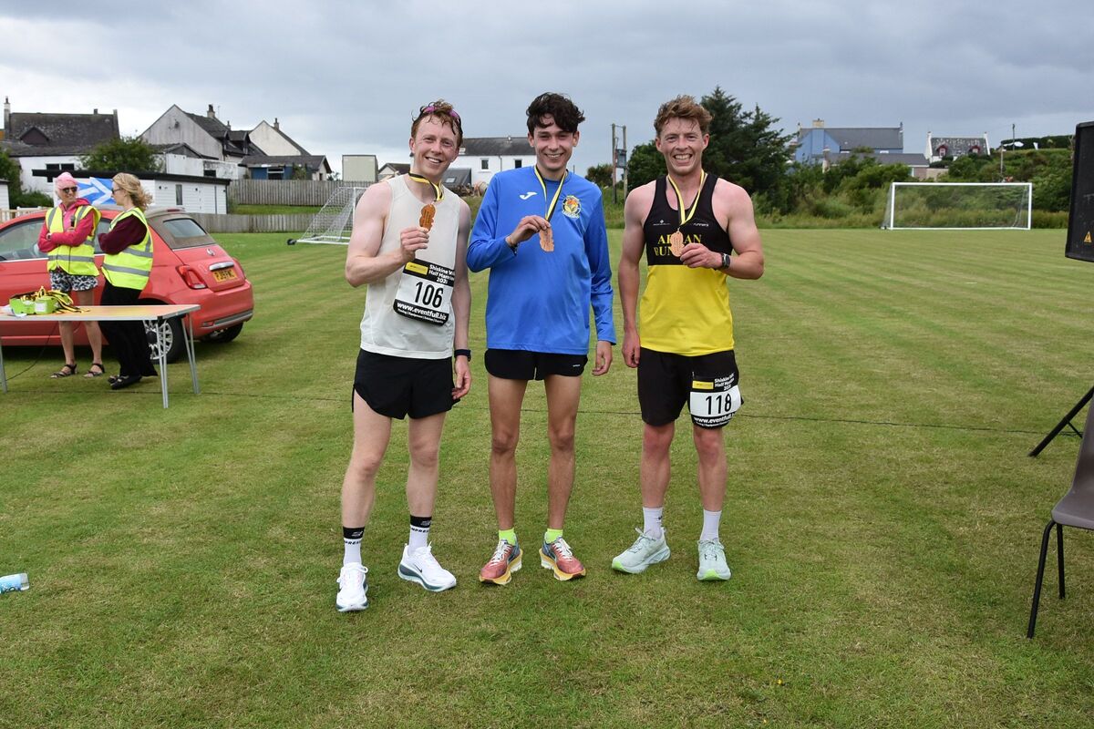 In first place was Tom Cowperthwaite of Shettleston Harriers, middle, in second place was Callum Totten, left, and Callum Clarke of Arran Runners secured third place and first local, right.