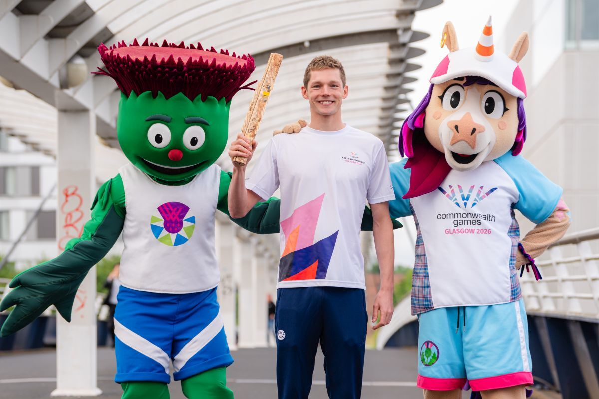 First official baton bearer Duncan Scotland MBE is pictured with Commonwealth Games' mascots, Clyde and Finnie. Photograph: CalMac
