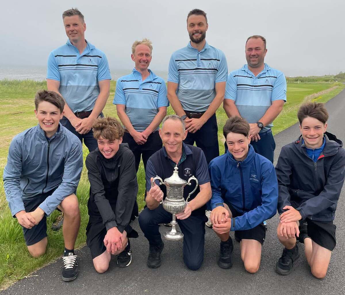 Brodick Golf Club captain Nicol Hume with the Hope Cup and the players and caddies that won the tournament for the eight consecutive year. Photograph: Brodick Golf Club. Brodick Golf Club captain Nicol Hume with the Hope Cup and the players and caddies that won the tournament for the eight consecutive year. Photograph: Brodick Golf Club.