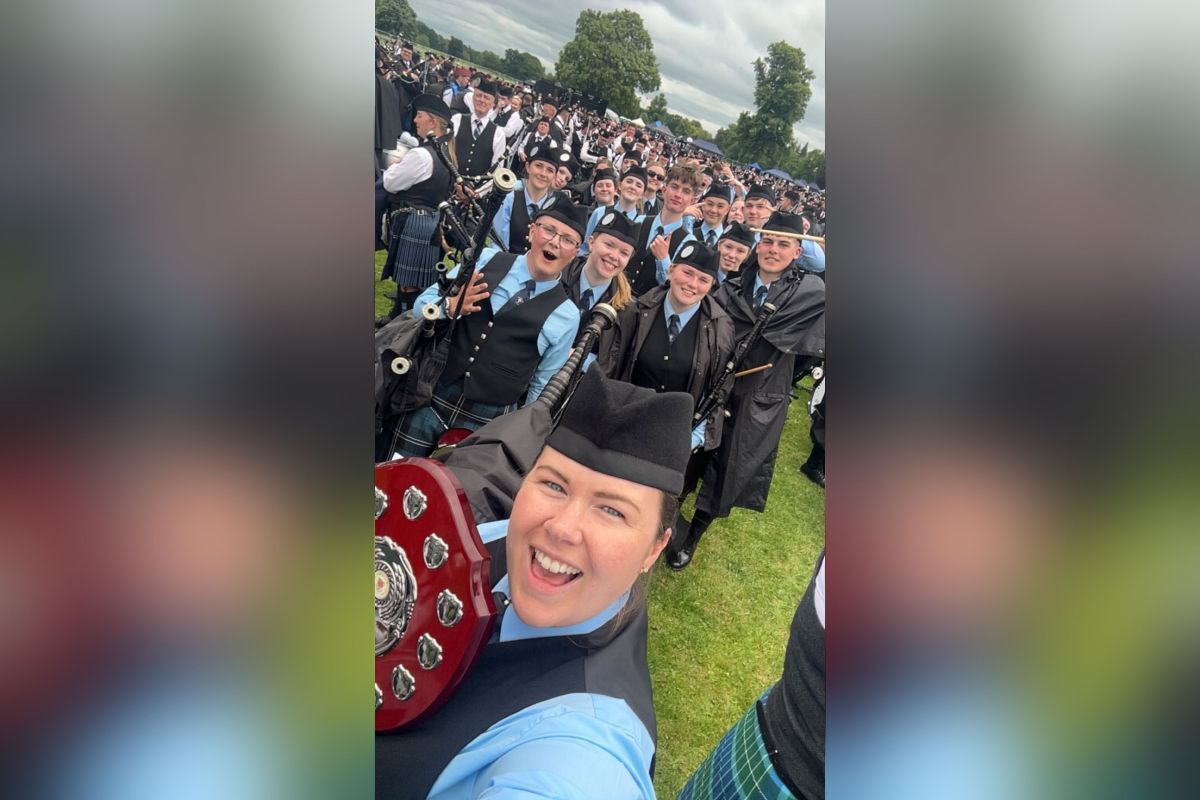 Kintyre Schools Pipe Band celebrating after securing fourth place in the Novice Juvenile B grade at the European Pipe Band Championships.