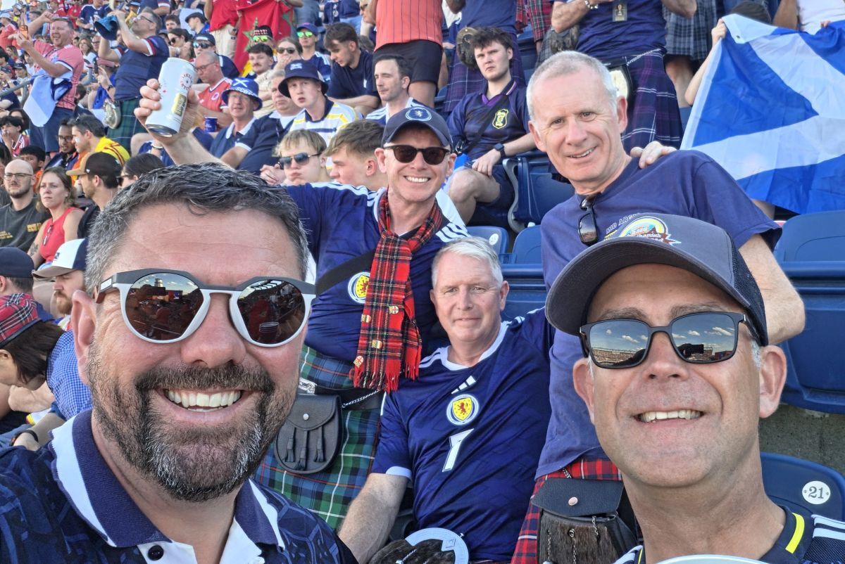 Ewen MacDonald, front left, and Ian Aitken, right, were stunned to discover they were sitting directly in front of Mid Argyll Tartan Army members Ali and Alistair Baker and Malcolm MacDonald of West Loch Shores Holiday Park at Boston’s Gillette Stadium.