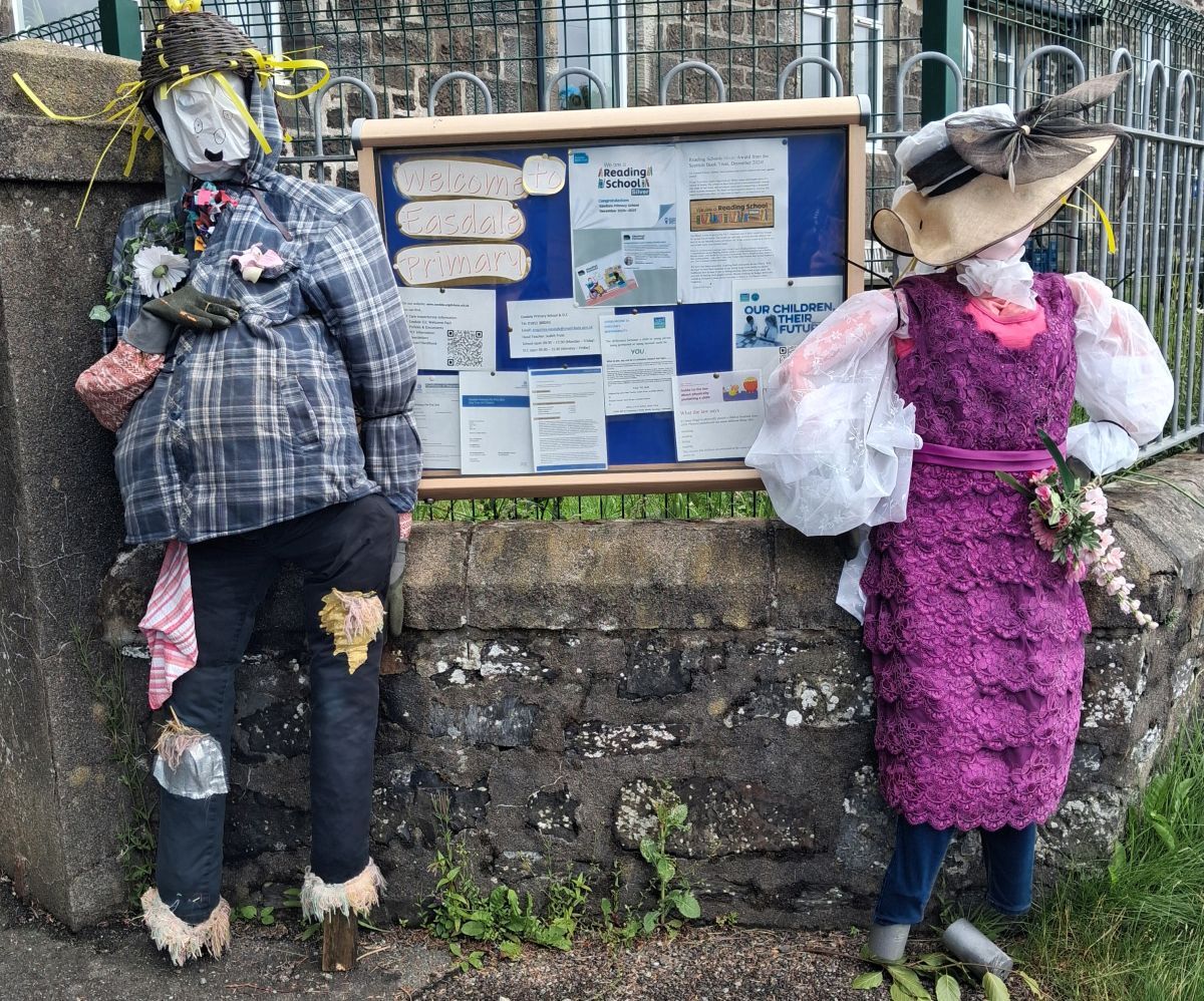 The new Mr and Mrs Scarecrow outside Easdale Primary School festival ready.